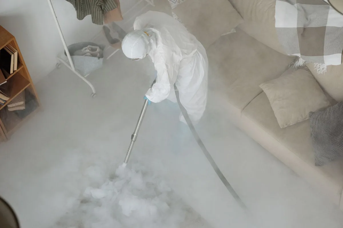 Biohazard cleanup technician in protective equipment, Forest Park, GA